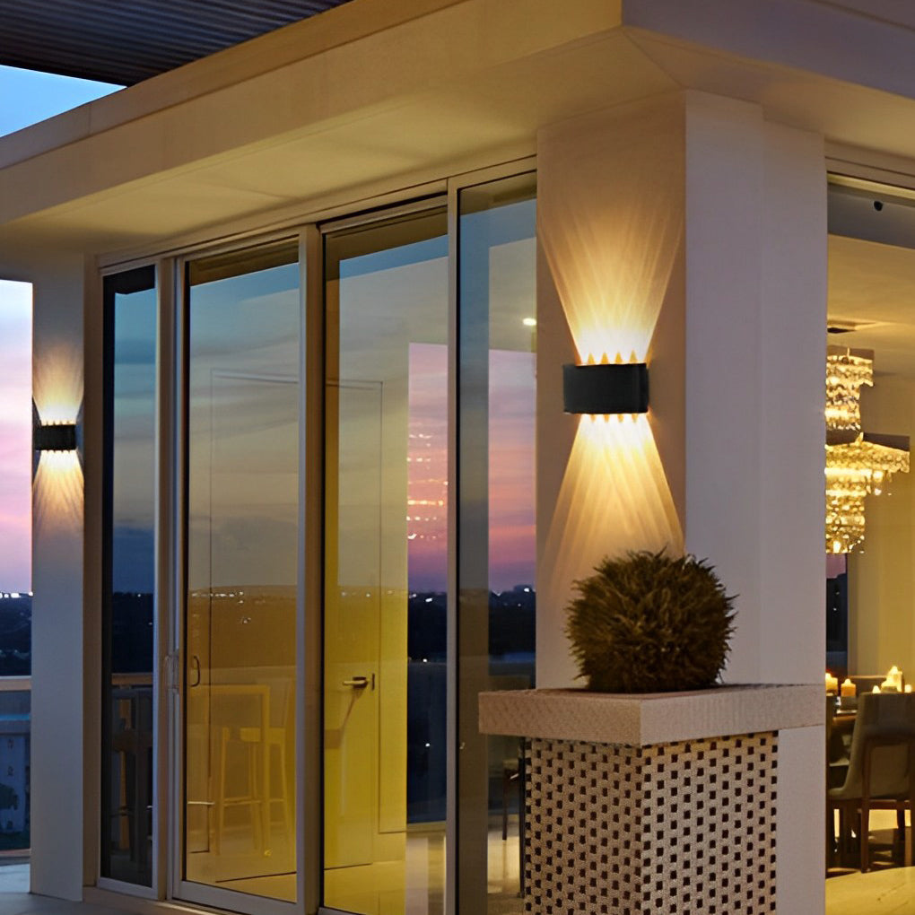 Up and down light wall sconce with detailed view of its cylindrical structure.