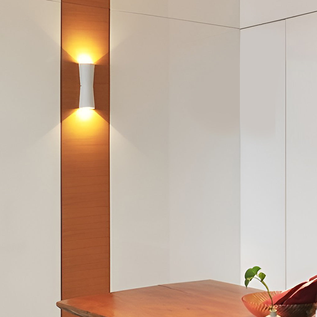 Interior application of up and down wall light creating soft ambient lighting in a living space.