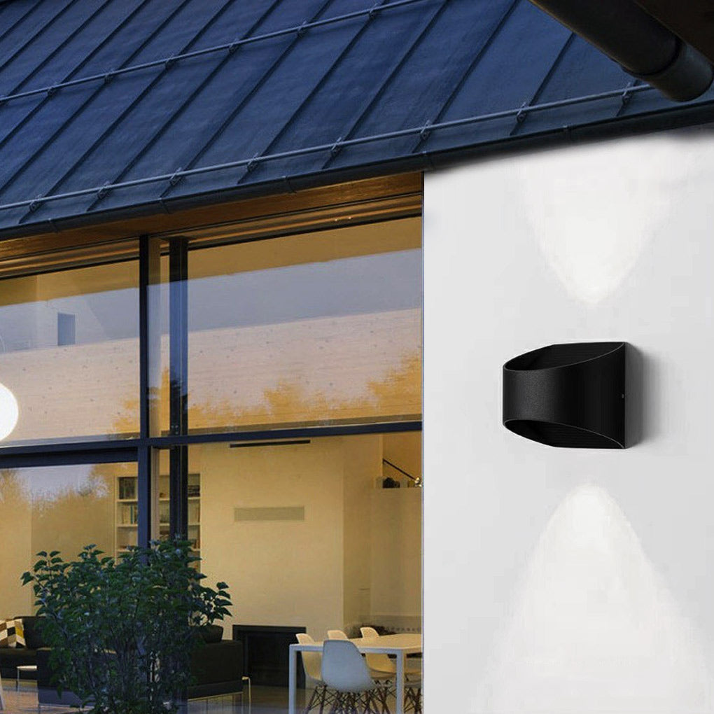 Up and down wall sconce lighting providing focused illumination on a modern staircase.