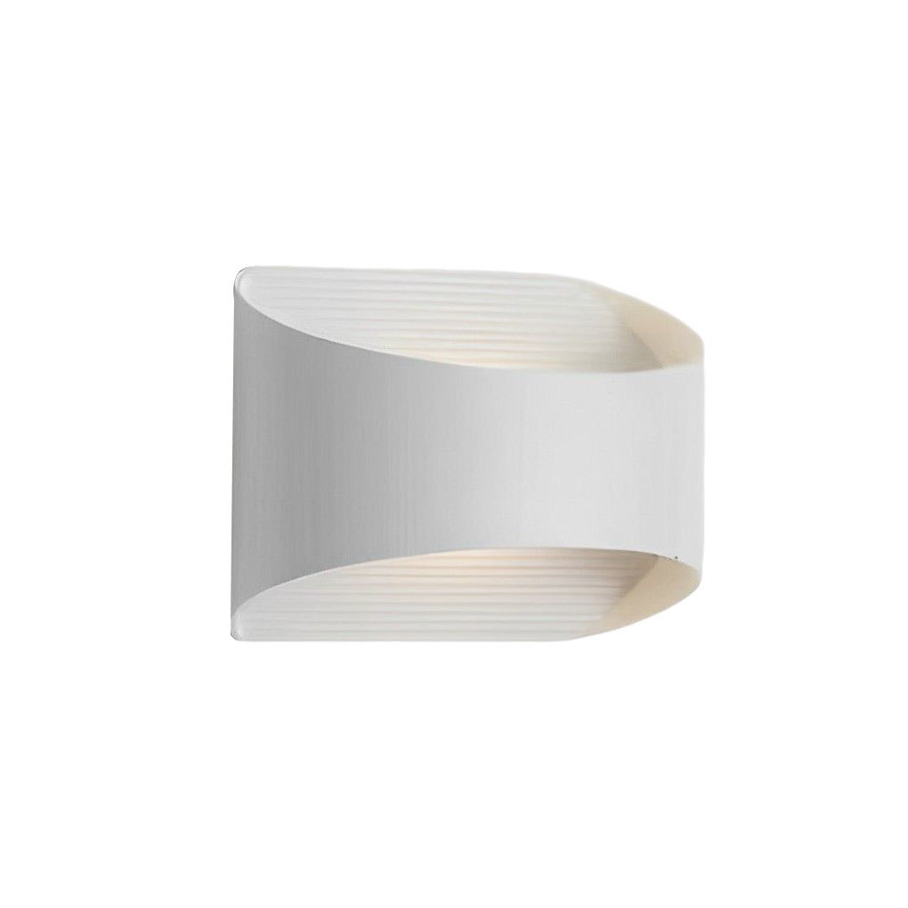 Up and down wall sconce lighting providing layered light in a modern bedroom setting.