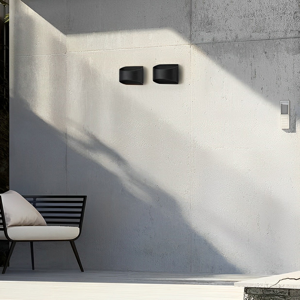 Up and down wall sconce lighting showcasing a modern design in a stylish dining area.