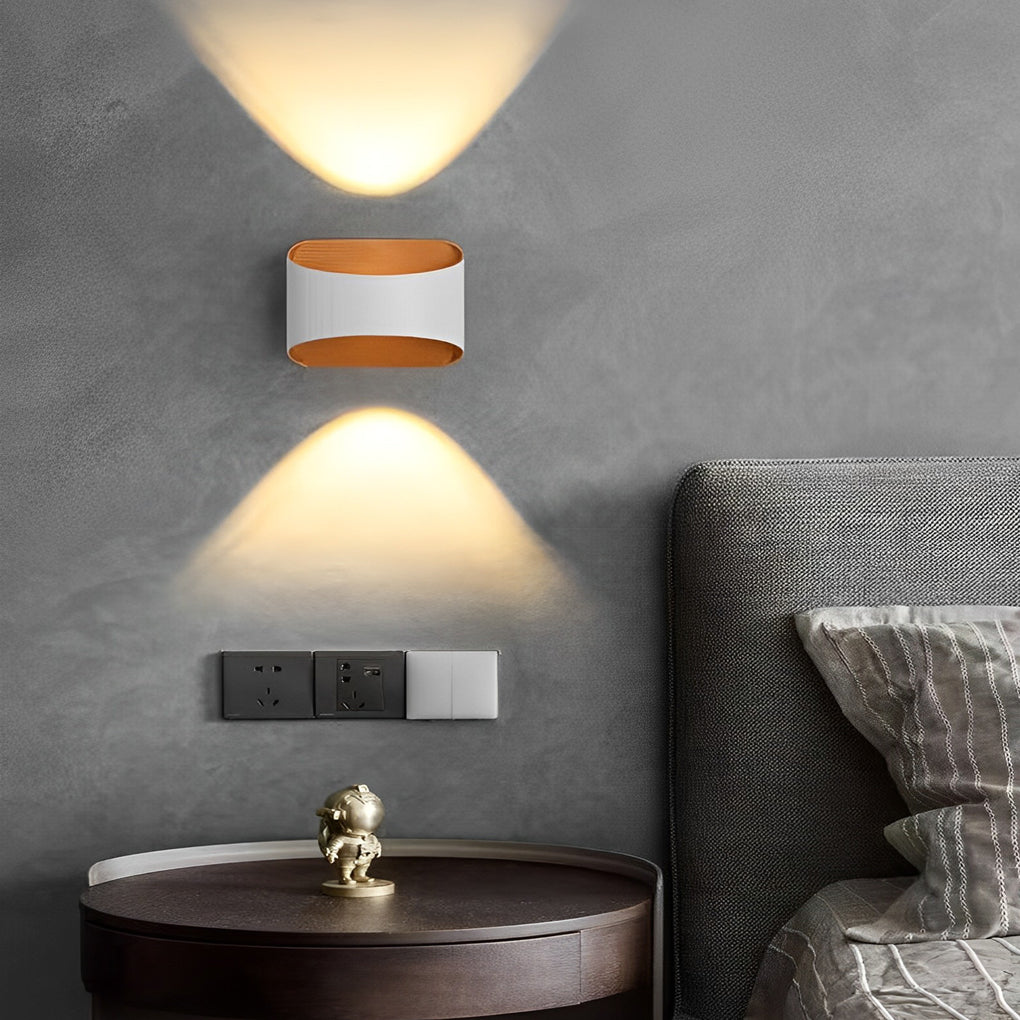 Up and down wall sconce lighting with a sleek design, installed in a contemporary hallway.