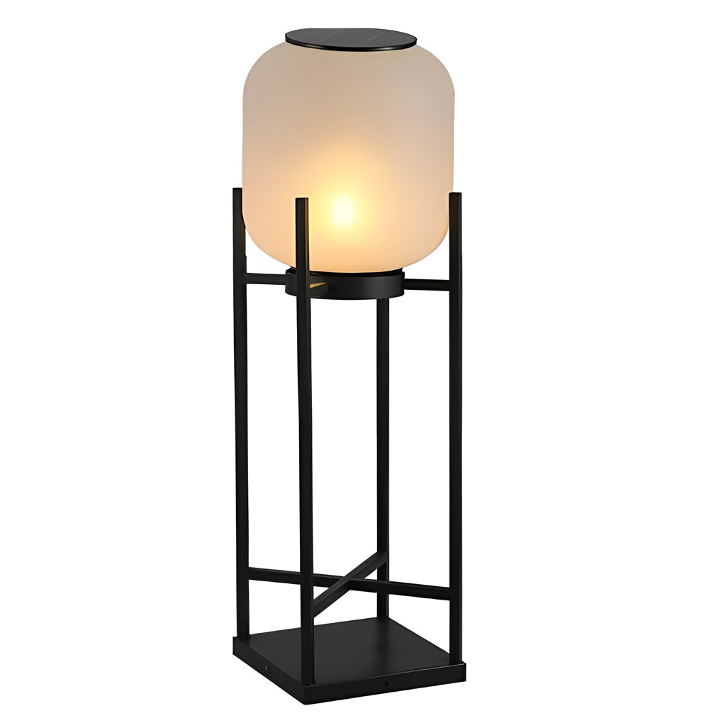 Outdoor standing light with frosted shade and black frame in urban rooftop garden setting.