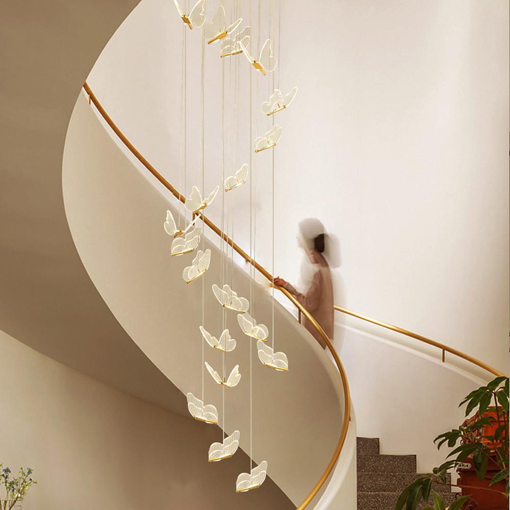 Vertical butterfly chandelier suspended in a tall atrium space.