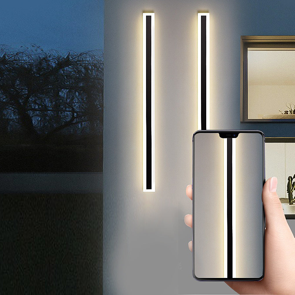 Acrylic wall sconce with vertical LED light, mounted on exterior wall for sleek and modern outdoor illumination