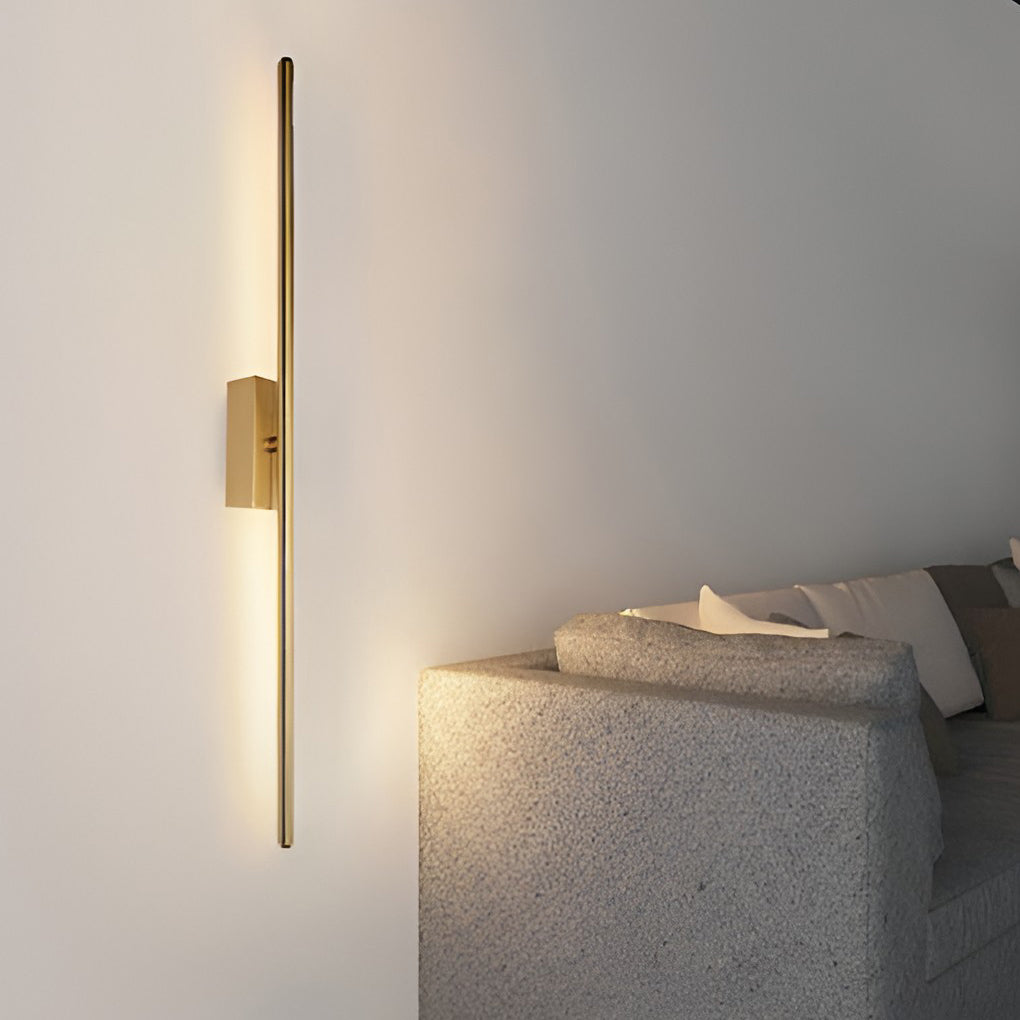 Vertical wall lights illuminating a minimalist interior with focused glow.
