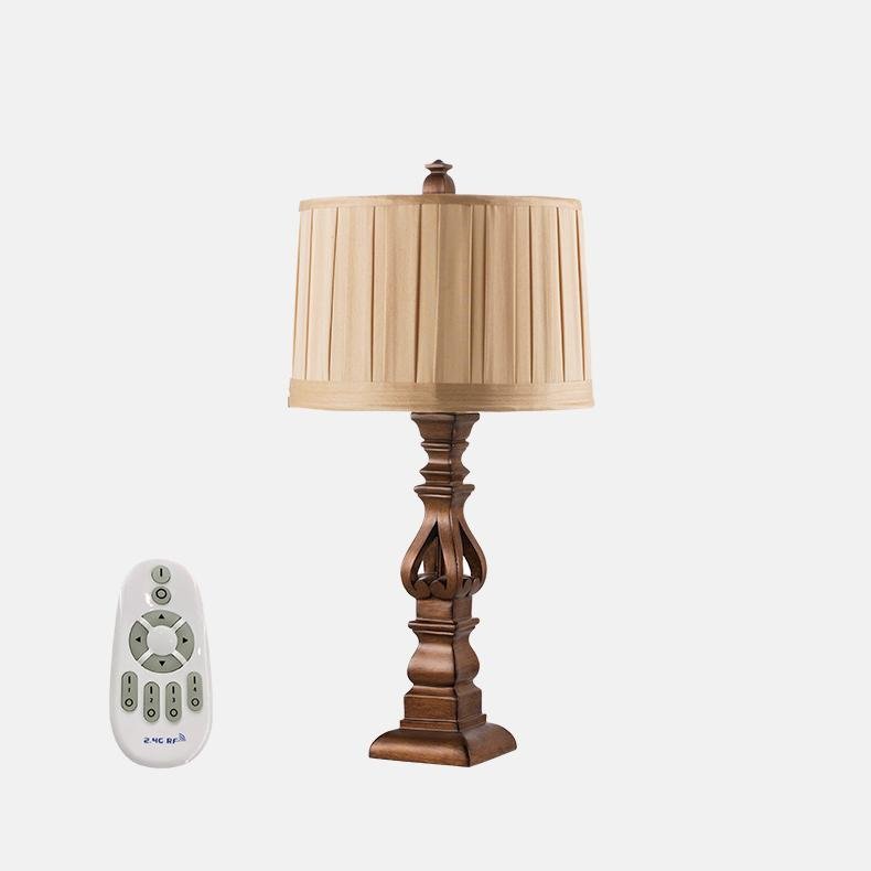 Close-up of vintage wood table lamp showcasing its striped shade and wooden base.