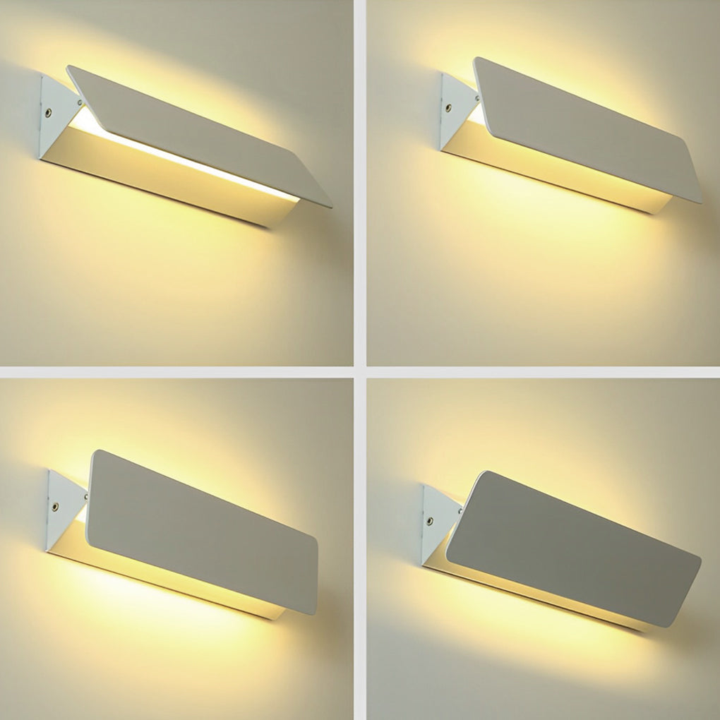 Wall adjustable light installed above bedside creating reading light effect.