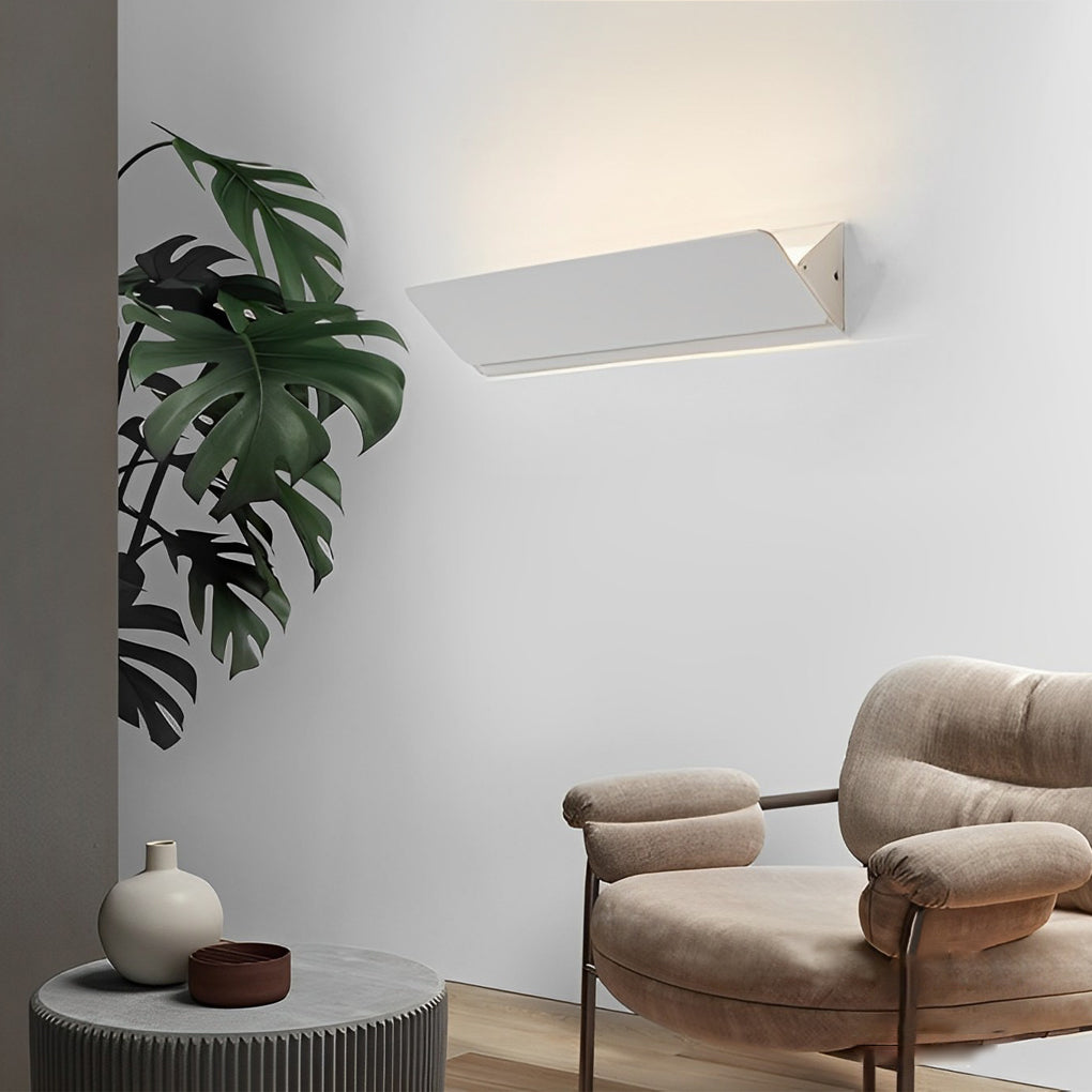 Wall adjustable light angled upward for indirect ambient lighting.
