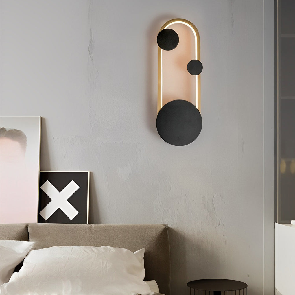 Wall mounted nightstand lights above a bed headboard, blending sculptural form with functional nighttime illumination.