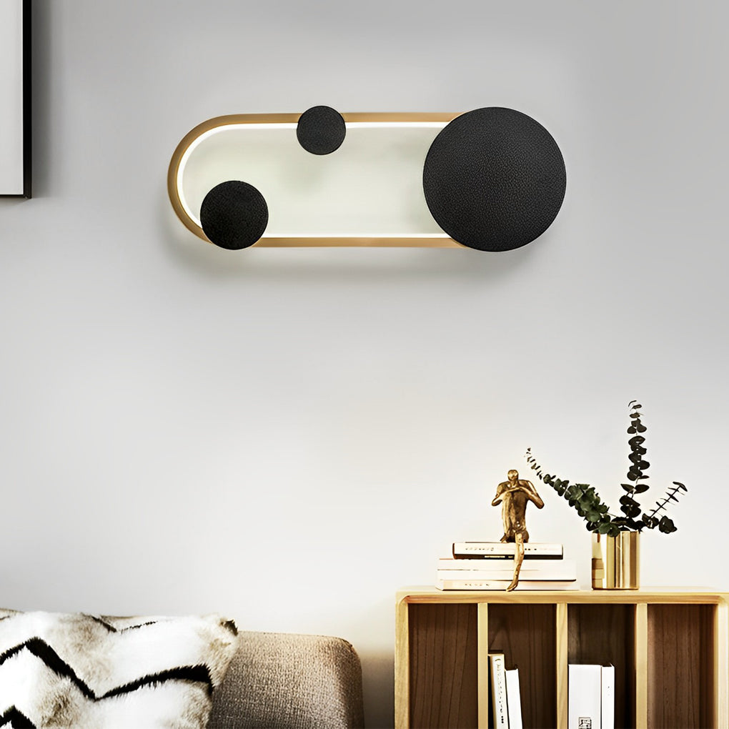 Wall mounted nightstand lights styled near a desk and chair, offering soft evening lighting for a multifunctional room.