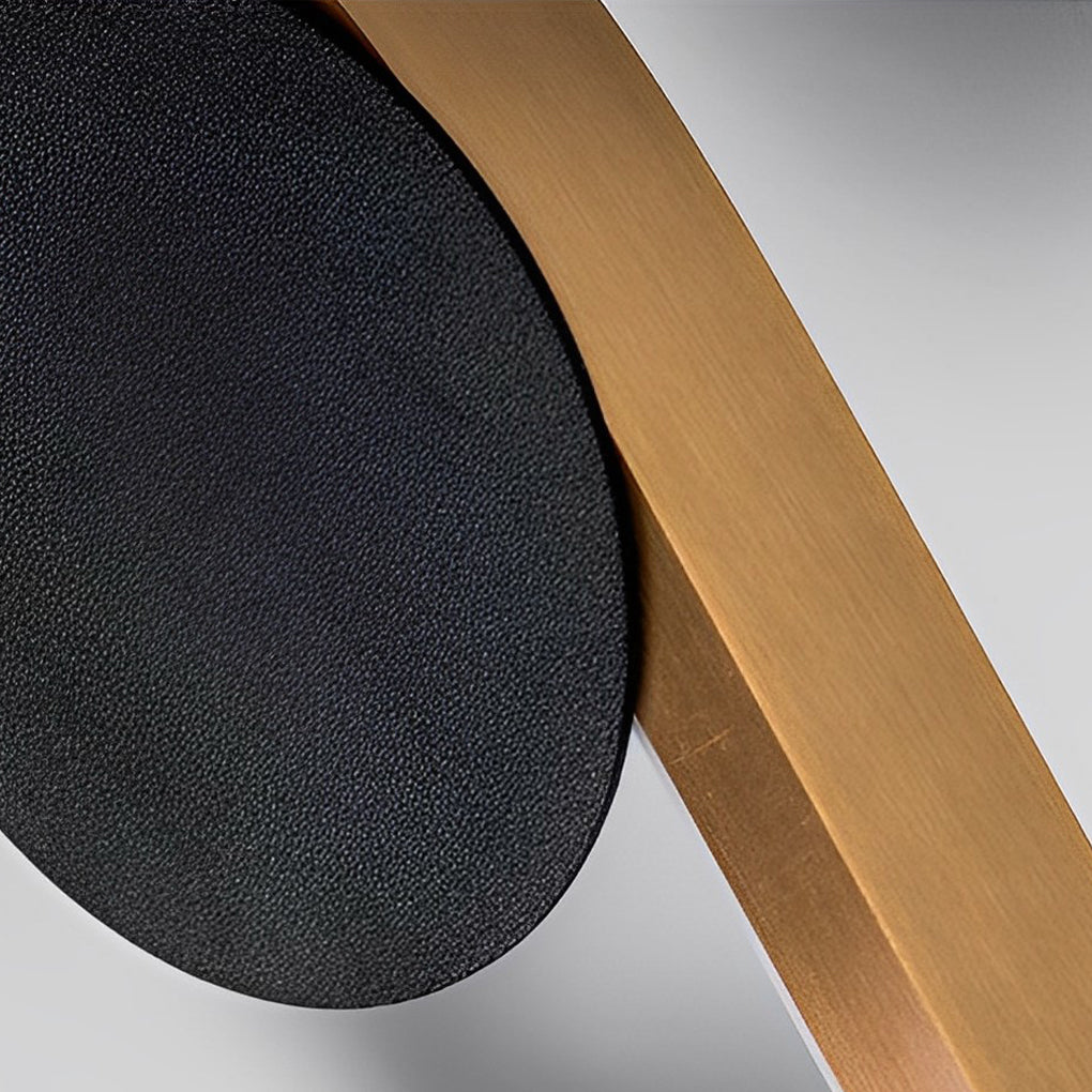 Wall mounted nightstand lights close-up showing smooth curved light diffusion and modern black circular details.