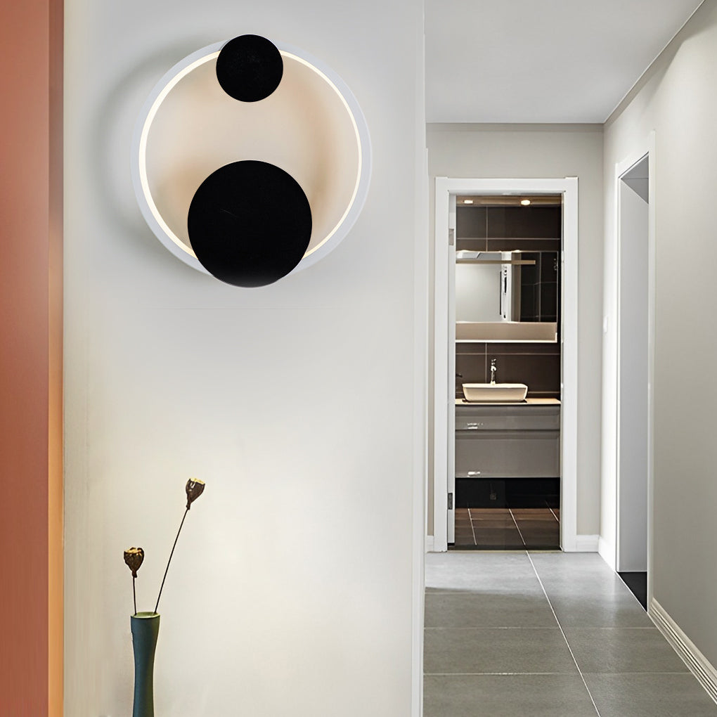 Wall mounted nightstand lights installed along a hallway wall, showing versatility beyond bedside use with soft ambient light.