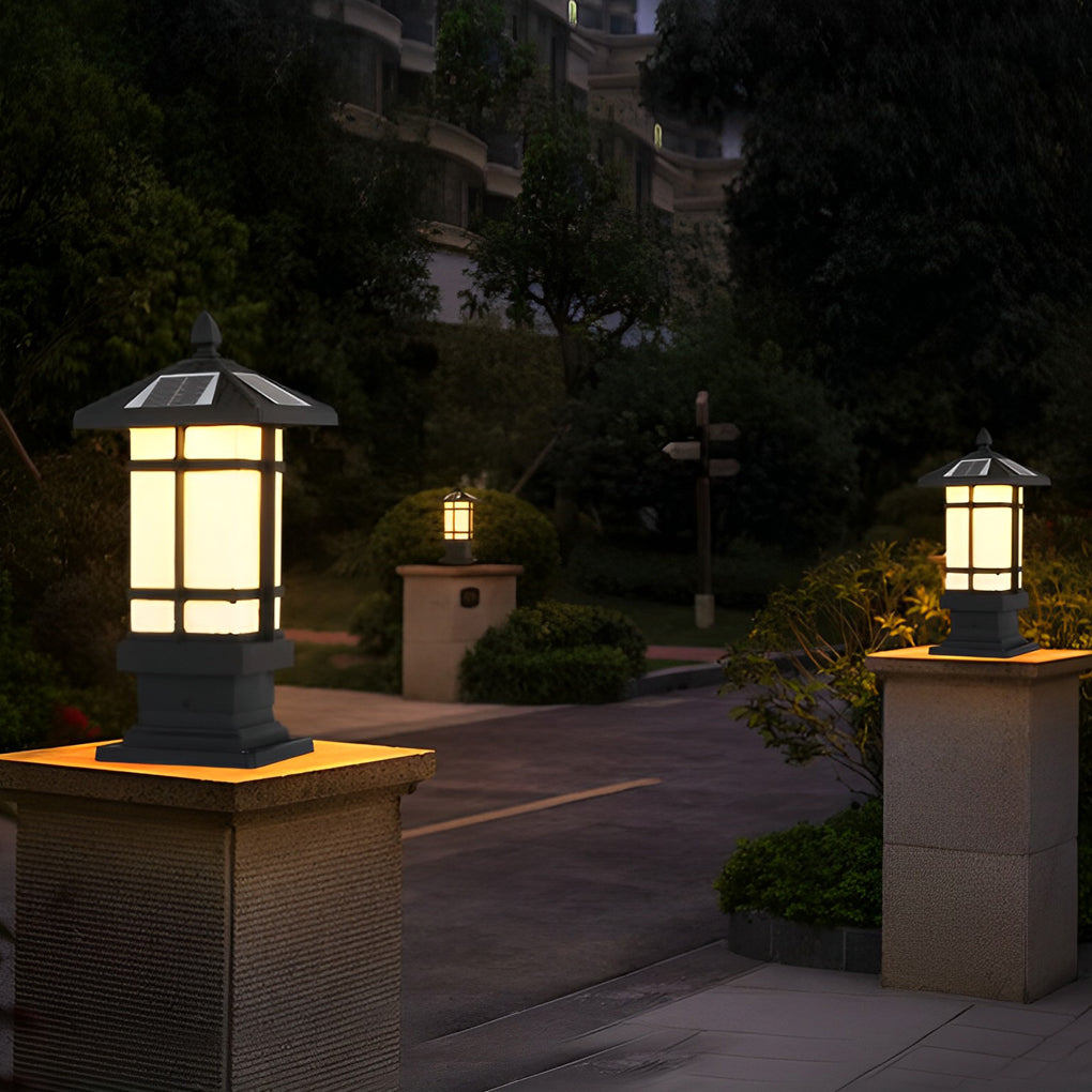 Wall pillar lights outdoor with a close-up of the illuminated light fixture.