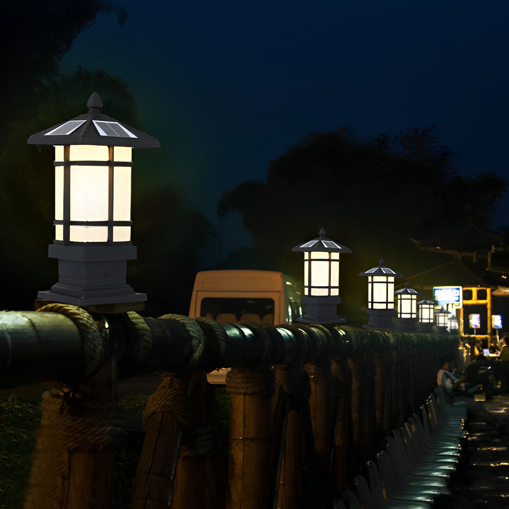 Wall pillar lights outdoor providing directional light in a rainy garden setting.