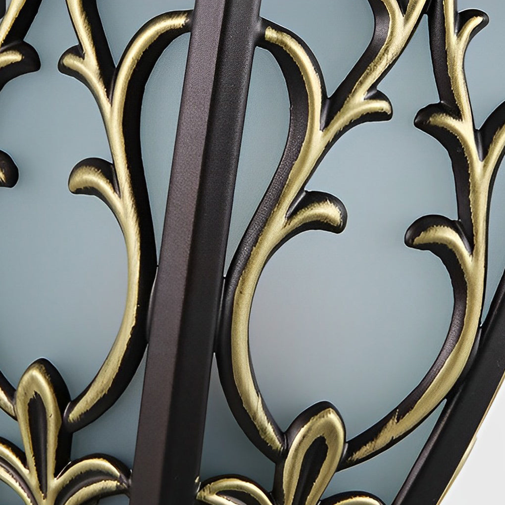 Wall sconce lantern with a detailed view of its mounting hardware and ornate design.