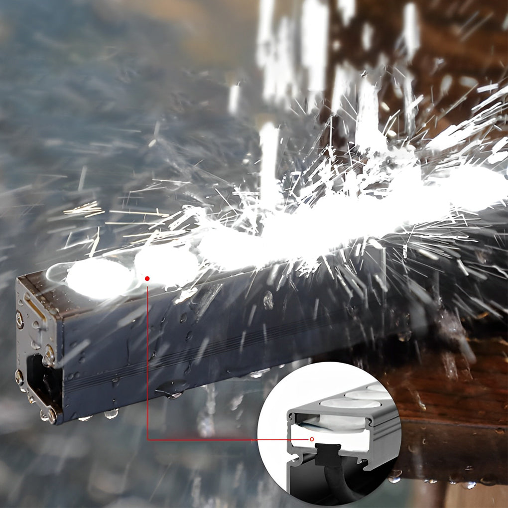 Waterproof facade wall washer light tested under heavy water spray.