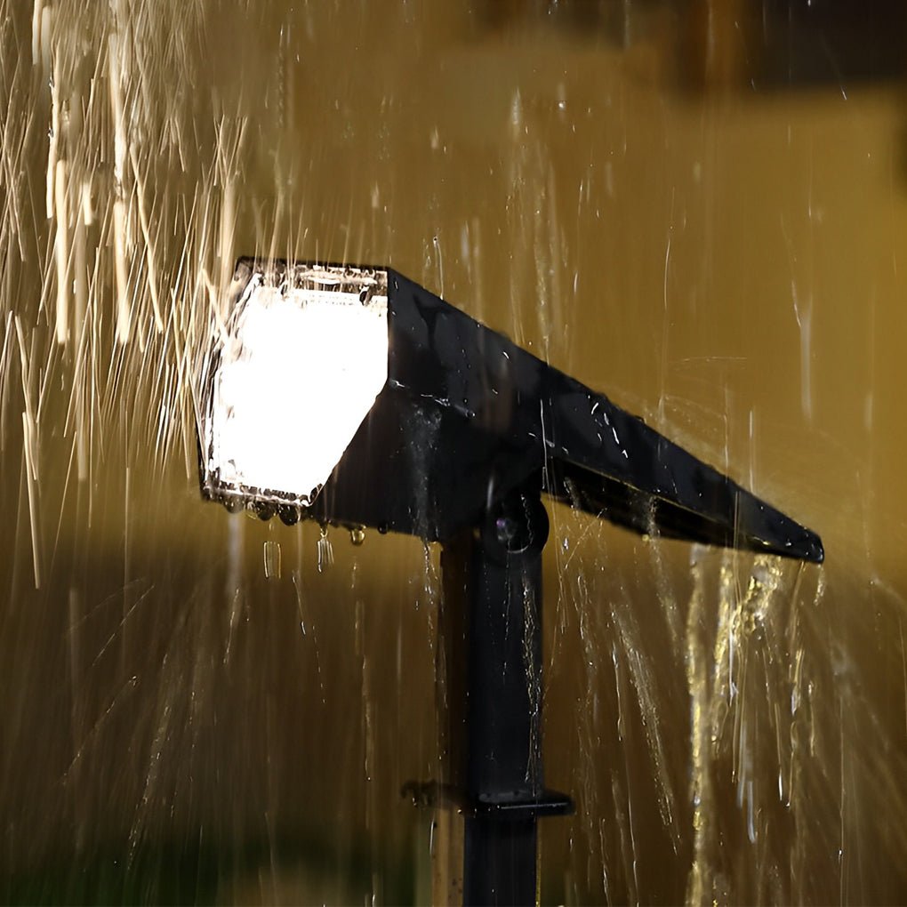 Waterproof flood spike light in rain with water droplets, showcasing durable outdoor lighting performance.