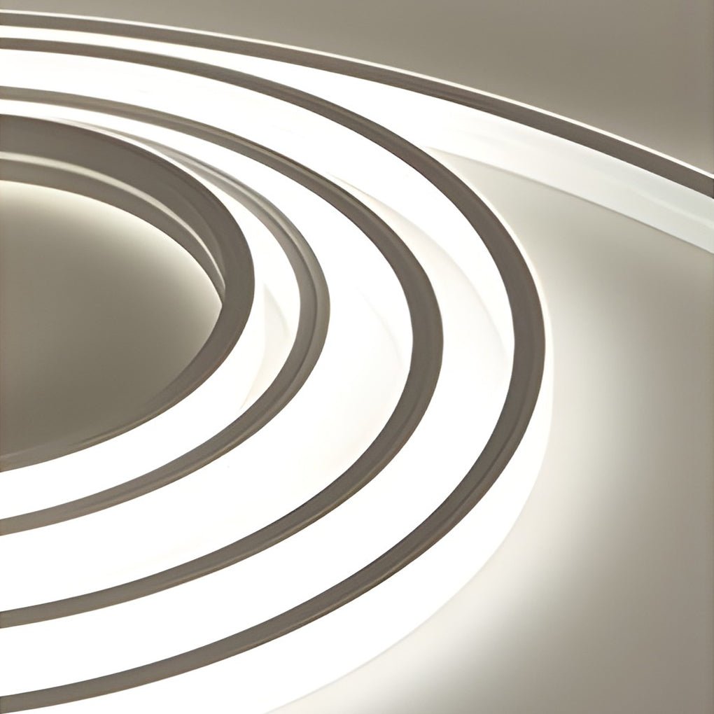 Neutral white waterproof LED strip lights forming curved linear patterns