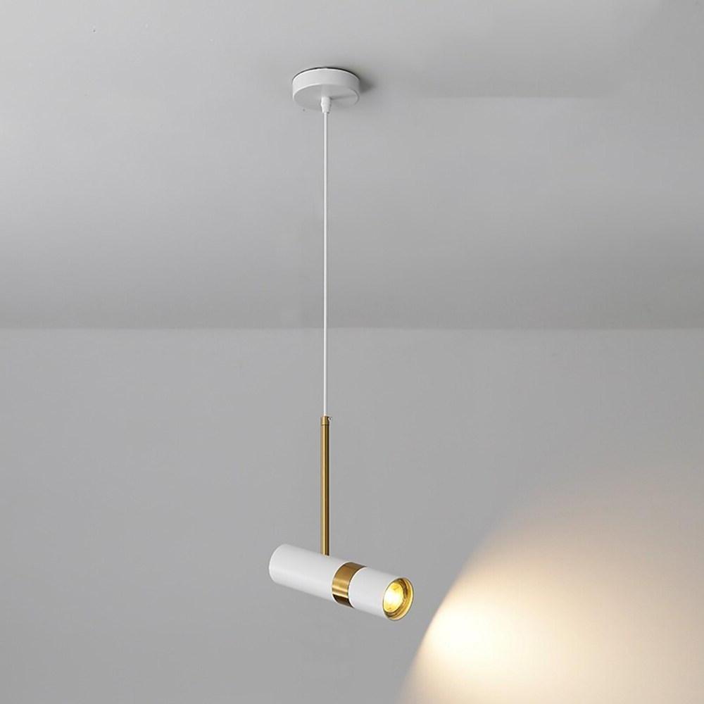 White adjustable cylindrical pendant light angled to highlight modern minimalist room interior.