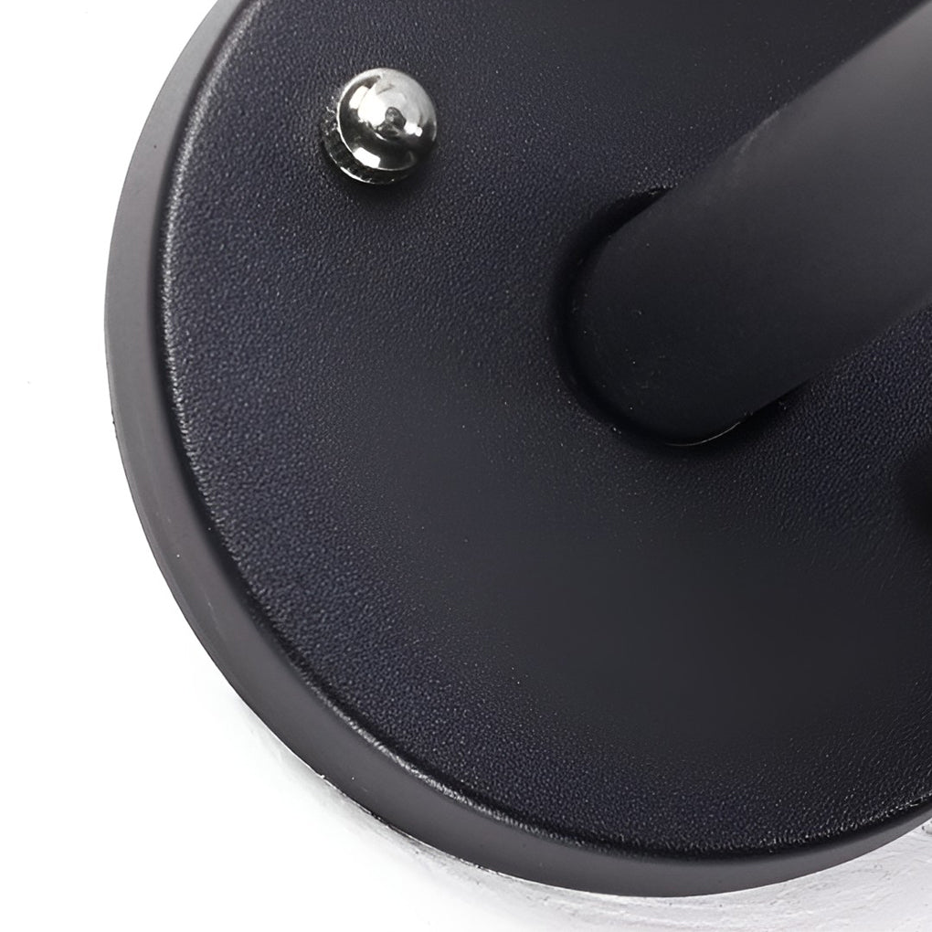 White outdoor globe wall sconce with close-up of the light diffusion pattern.