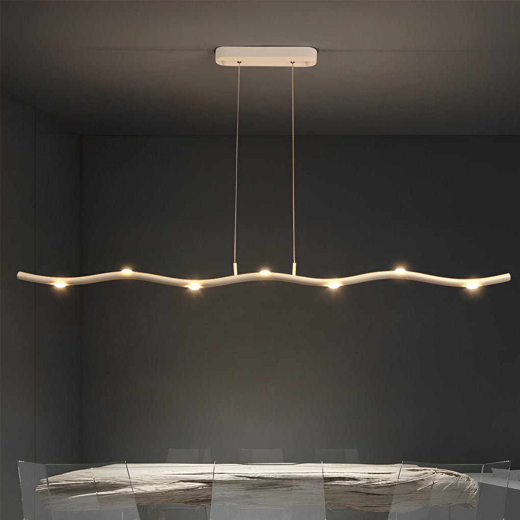White wave pendant light providing ambient illumination in a contemporary meeting room.