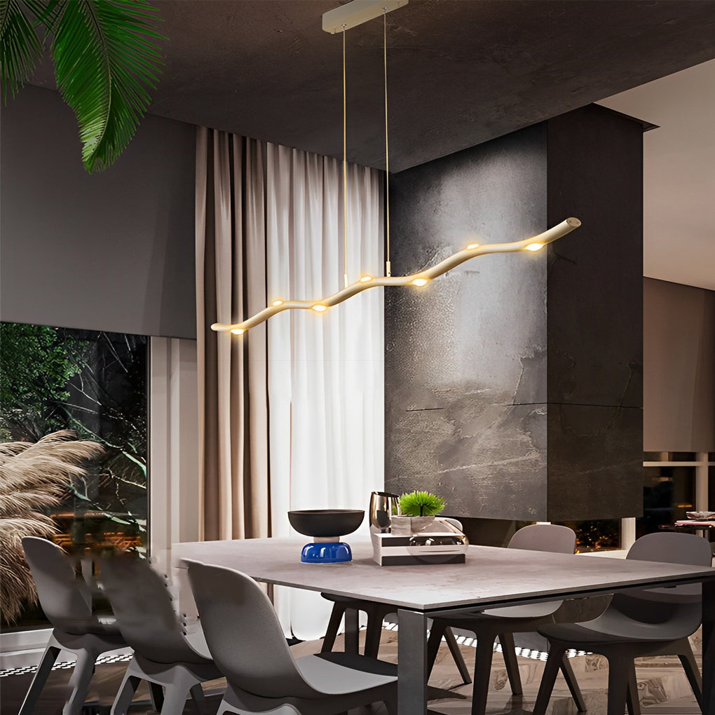 White wave pendant light with a modern design, installed above a kitchen island.