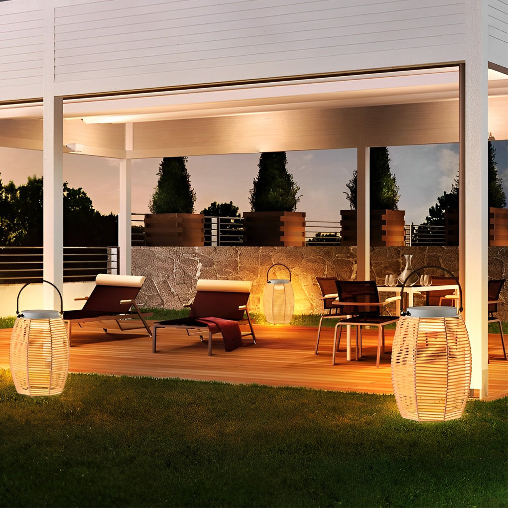 Woven rattan lanterns with a solar panel, providing eco-friendly lighting in a garden.